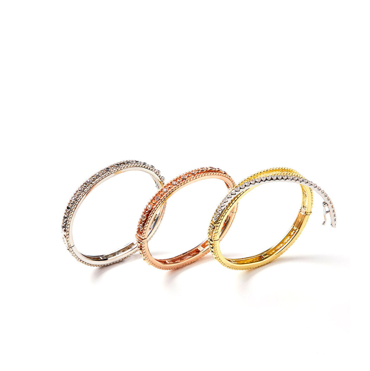 Interchangable and customizable gold and diamond bangle bracelets by Chicago jeweler, Lester Lampert
