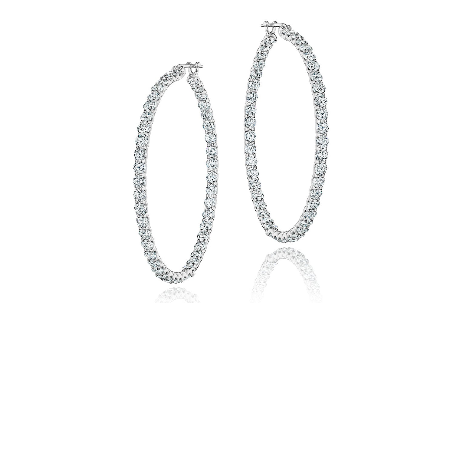 Platinum and diamond hoop earrings made in Chicago by jeweler Lester Lampert.