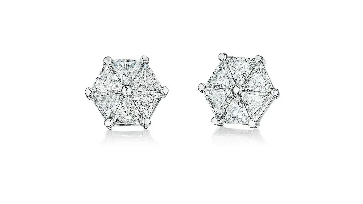 Six perfectly matched trilliant diamonds in earrings handcrafted by Chicago jeweler, Lester Lampert.