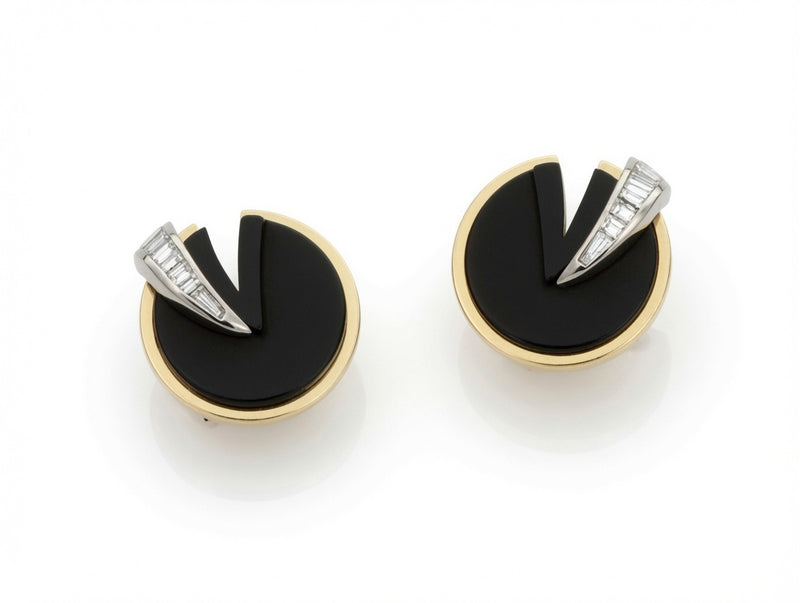 Round black and gold earrings with a baguette diamond wedge