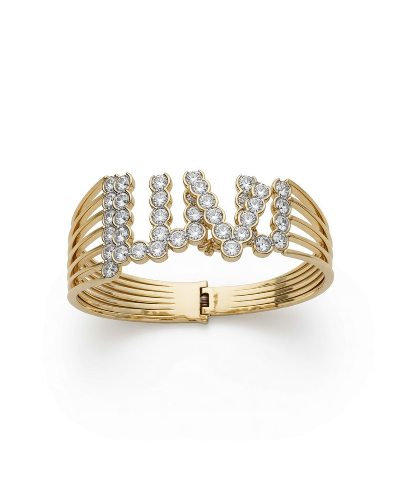 Gold cuff with the words I LUV U spelled in diamonds