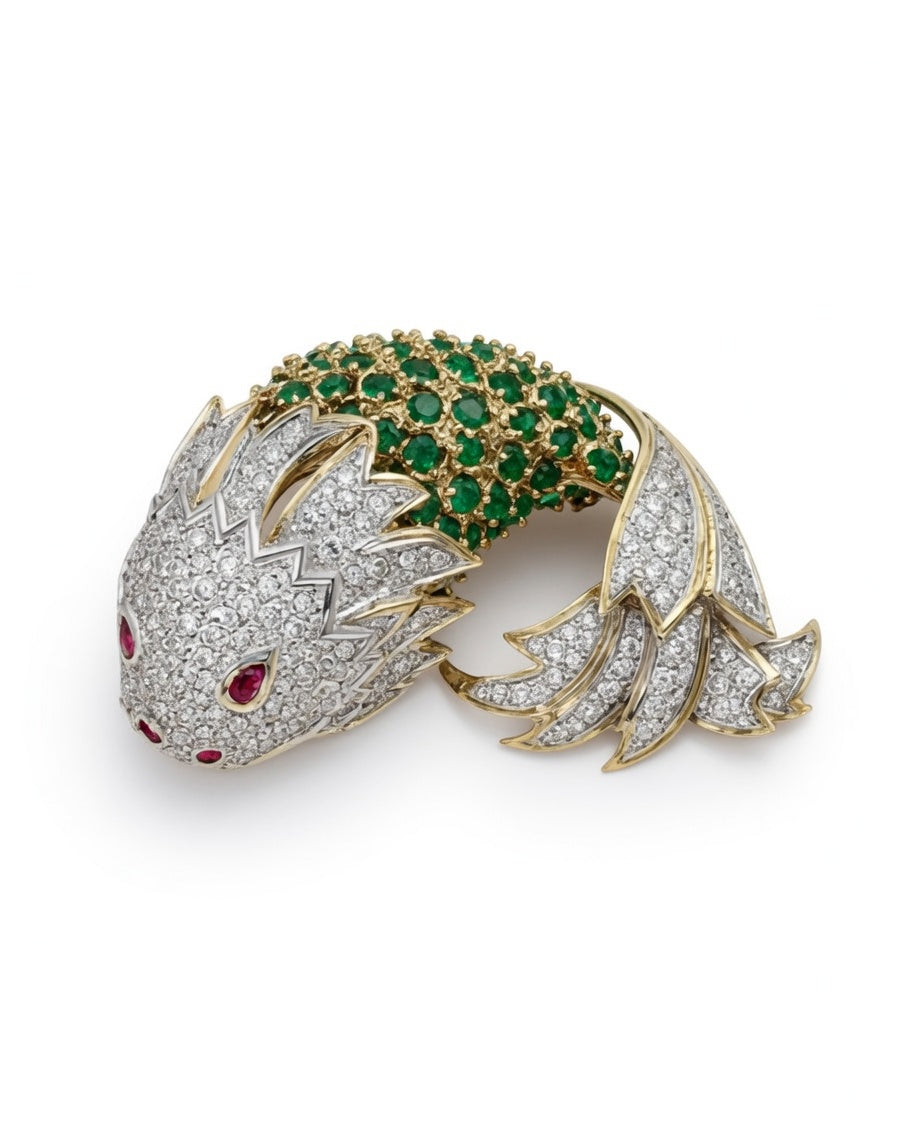 Fish-shaped brooch with a diamond head, ruby eyes and an emerald body