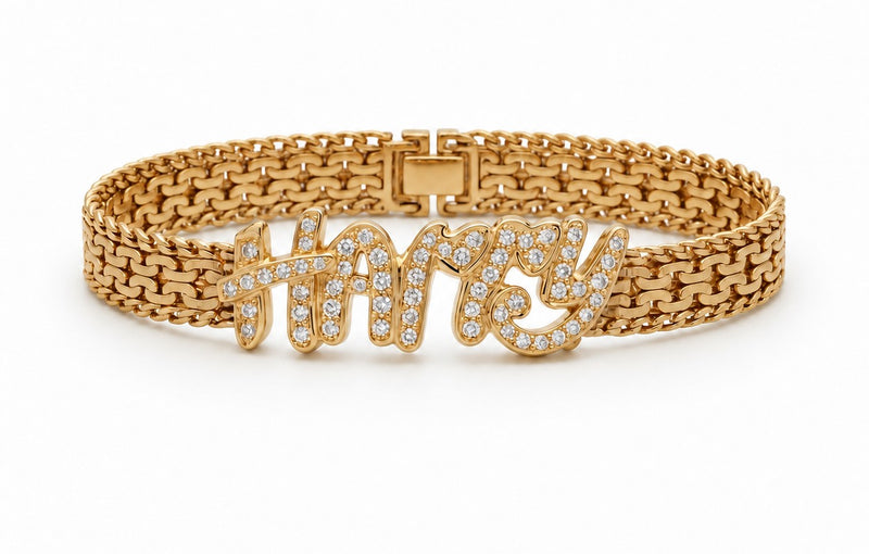 Gold woven-link bracelet with a name spelled in diamonds