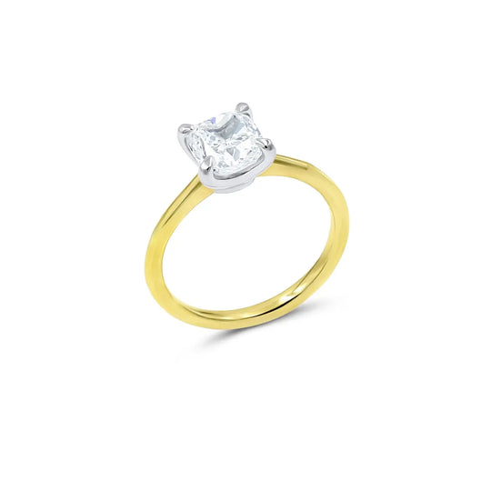 Two-tone diamond engagement ring by Chicago jeweler featuring round center stone in mixed metal setting