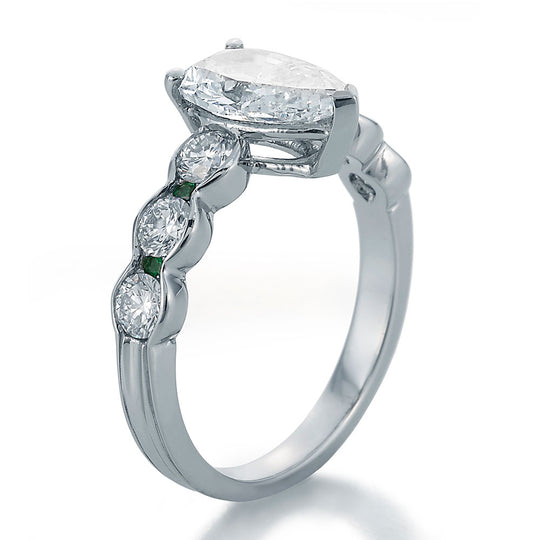 Side View Image of Pear Shape Center with Round Diamonds and Emeralds Engagement Ring