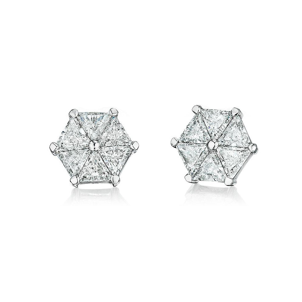 Diamond and platinum earrings featuring triangle shaped diamonds by Chicago based jeweler, Lester Lampert.
