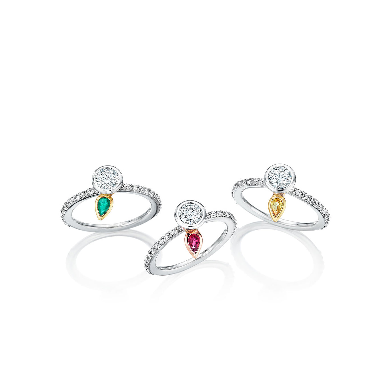 Beautiful ring collection featuring pear shape colored stone to represent each child’s birth stone from Chicago jewelry designer, Lester Lampert.