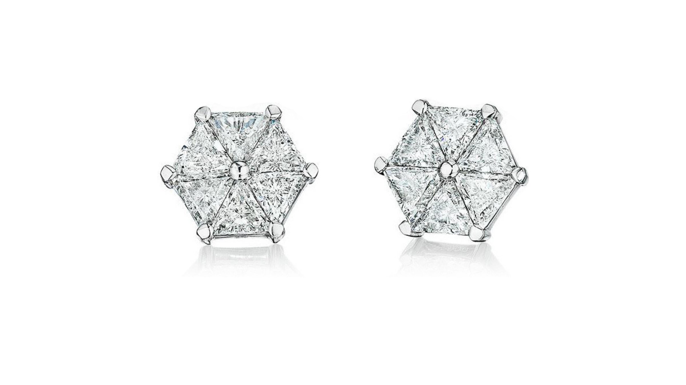 Six perfectly matched trilliant diamonds  in earrings handcrafted by Chicago jeweler, Lester Lampert.