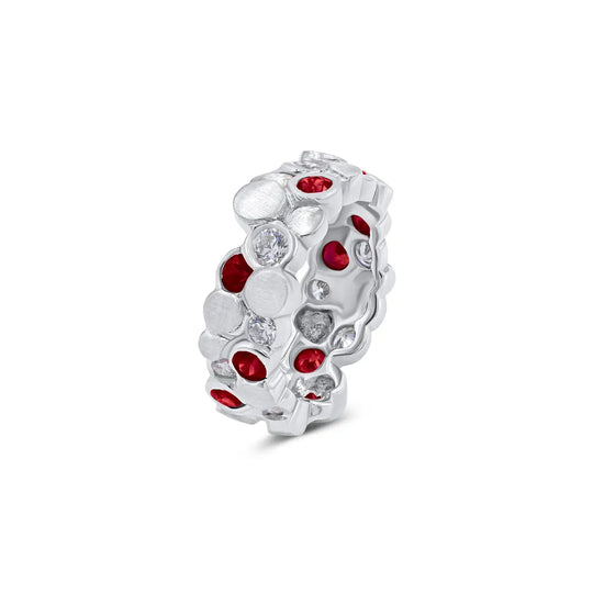 The BubbeLLes™ Ring by Lester Lampert in 18k white gold, featuring Ideal-cut diamonds and vibrant rubies in a multidimensional design, crafted by a Chicago jeweler.