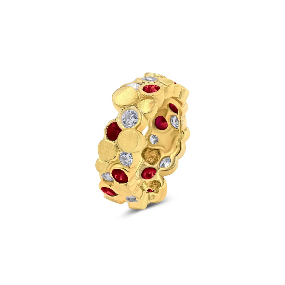 The BubbeLLes™ Ring by Lester Lampert in 18k yellow gold, featuring Ideal-cut diamonds and rich rubies in a unique layered design, crafted by a Chicago jeweler.