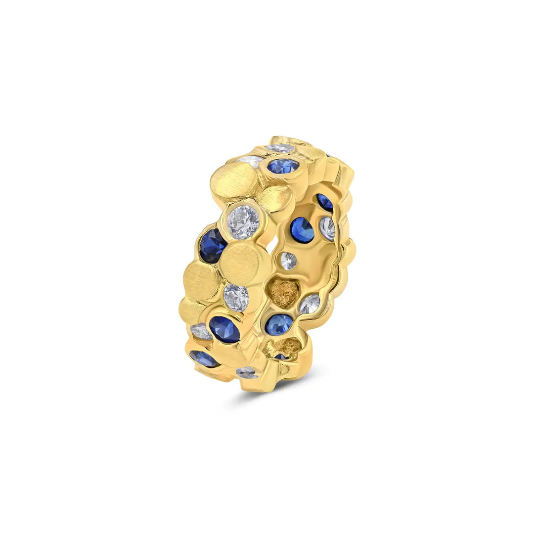 The BubbeLLes™ Ring by Lester Lampert in 18k yellow gold, showcasing Ideal-cut diamonds and elegant sapphires with bright and satin finishes, available at a Chicago jewelry store.