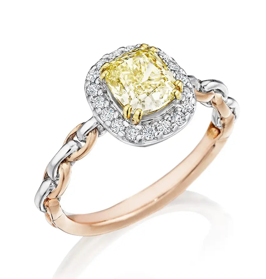 Custom yellow diamond engagement ring set in rose and platinum from our Chicago jewelry store.