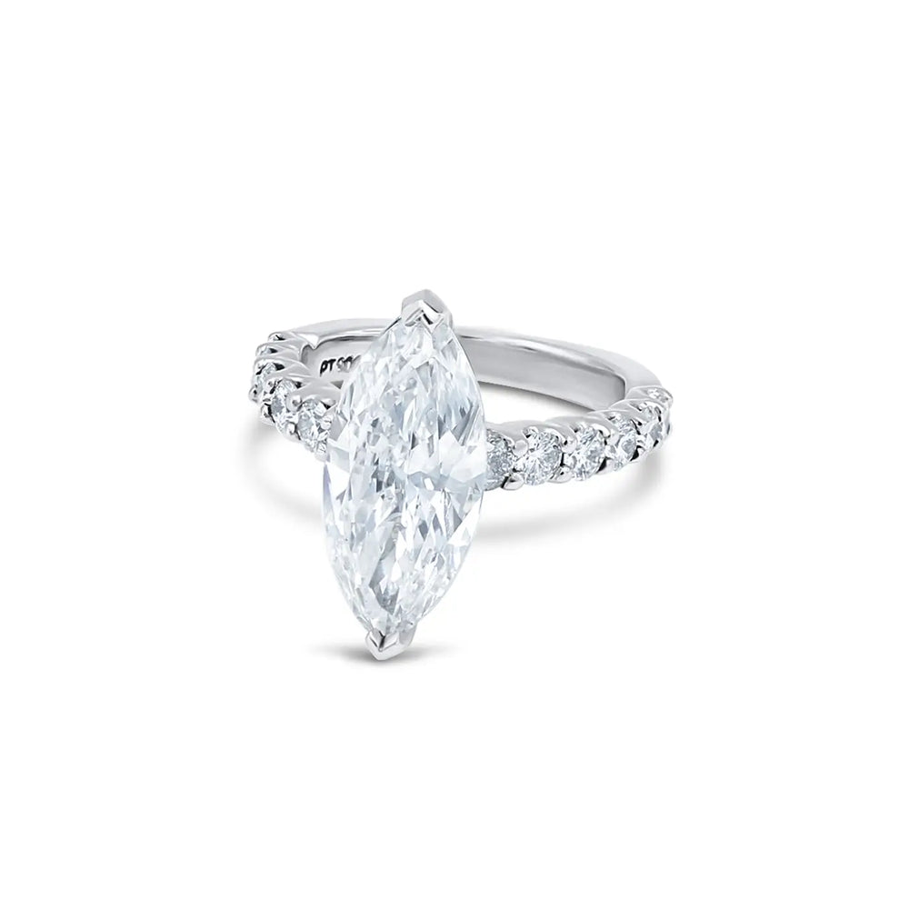 Unique marquise diamond engagement ring, custom-designed in Chicago, elegant gold setting, sparkling ethical center stone